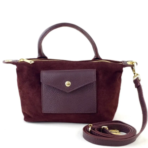 suede_mini_crossbody_with_a_gold_zipper_and_strap_on_a_white_background.png mini suede crossbody bag